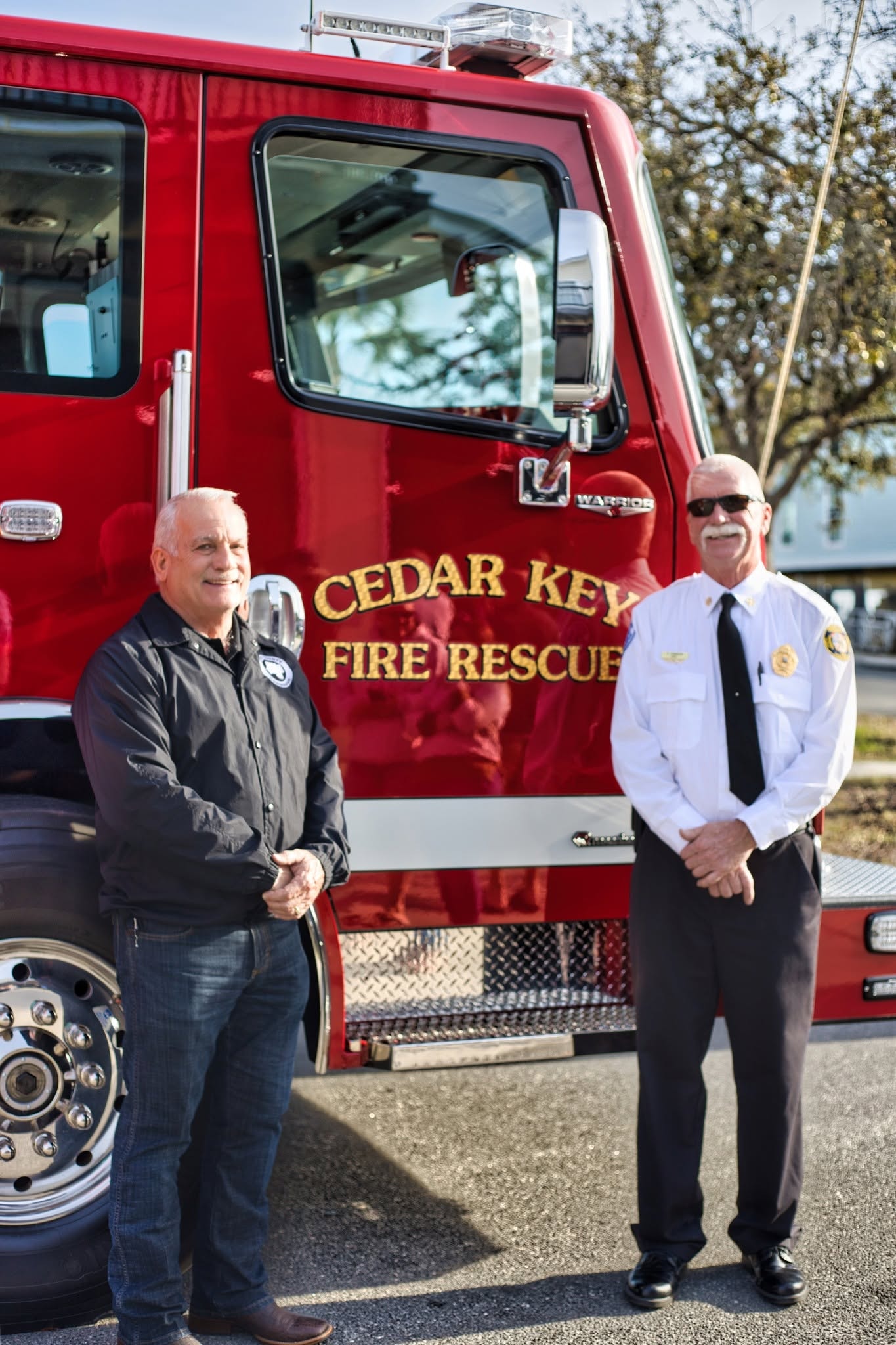 Cedar Key Fire Chief and officials at the truck unveiling ceremony